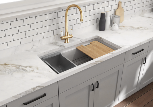 Undercounter Fireclay Workstation Sink by Savile Row - installed view with colander and chopping board