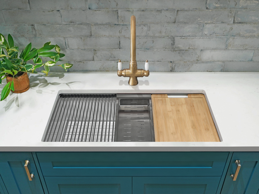 Undercounter Fireclay Workstation Sink by Savile Row - installed view with grid colander and chopping board